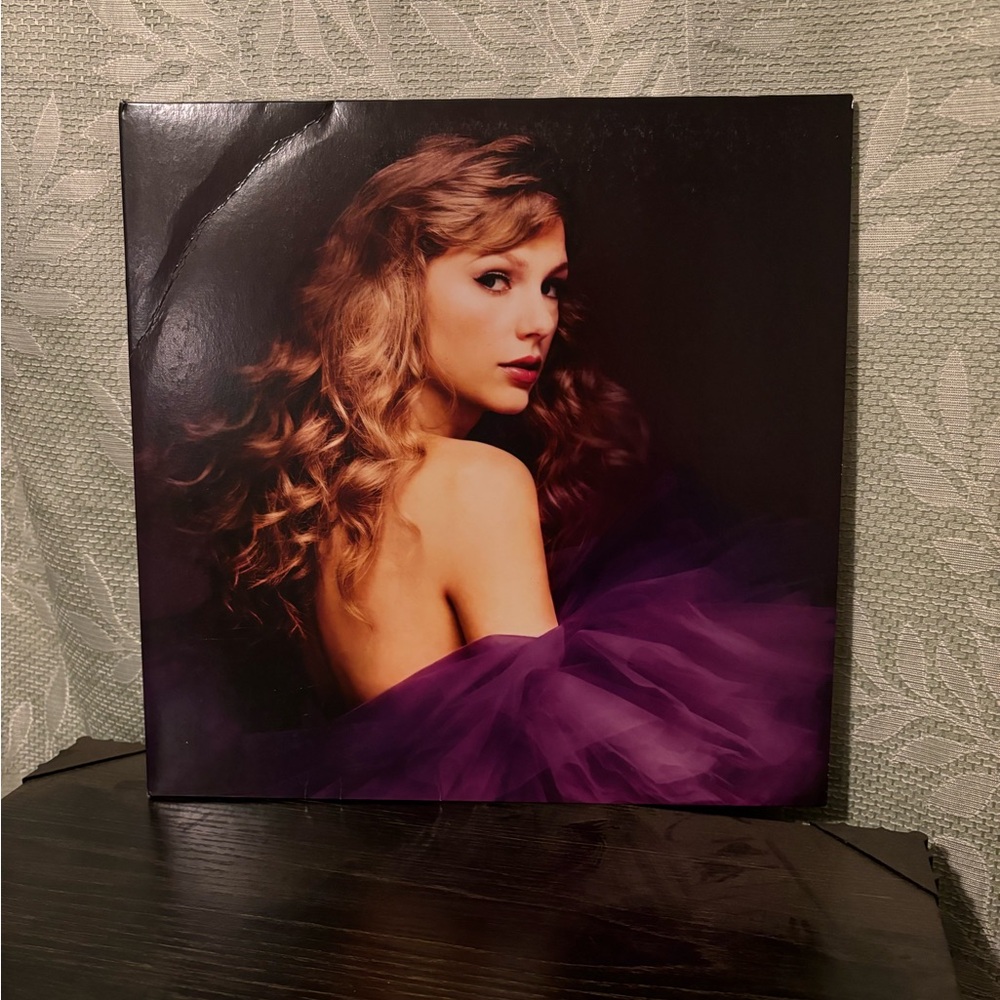 Taylor swift vinyls. Barely used in covers on shelf’s
